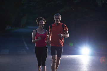 Image showing couple jogging at early morning