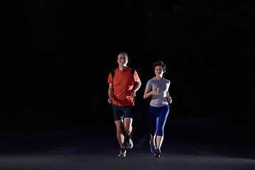 Image showing couple jogging at early morning