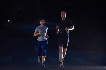 Image showing couple jogging at early morning