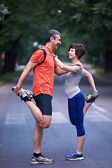 Image showing jogging couple stretching