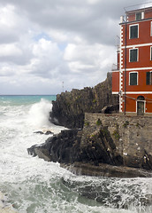 Image showing l Riomaggiorre Cinque Terre  old building raging stormy sea  cli
