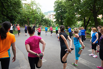 Image showing jogging people group stretching