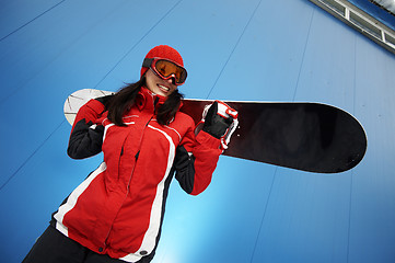 Image showing young adult female snowboarder