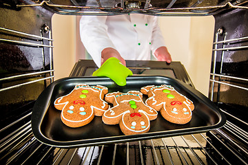 Image showing Baking Gingerbread man in the oven