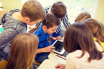 Image showing group of school kids with tablet pc in classroom