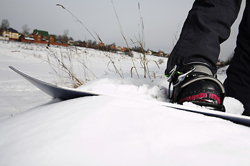 Image showing young adult female snowboarder