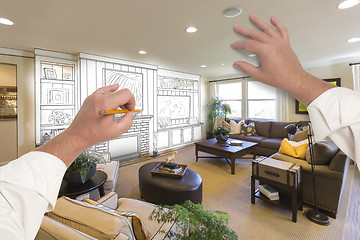 Image showing Male Hands Drawing Entertainment Center Over Photo of Home Inter