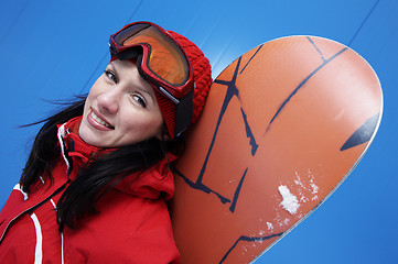 Image showing young adult female snowboarder