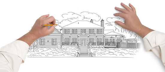 Image showing Male Hands Sketching A Beautiful House