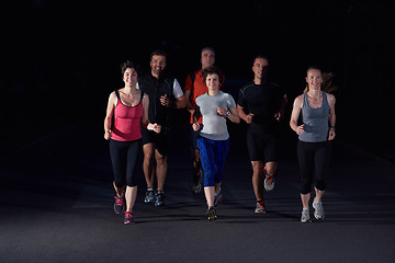 Image showing people group jogging at night