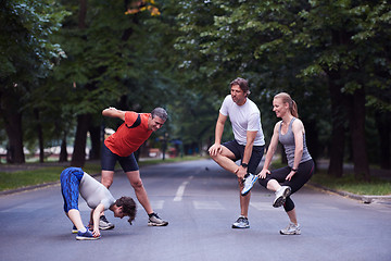 Image showing jogging people group stretching