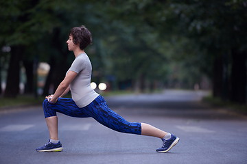 Image showing woman  stretching before morning jogging