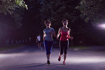 Image showing couple jogging at early morning