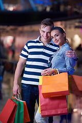 Image showing young couple with shipping bags