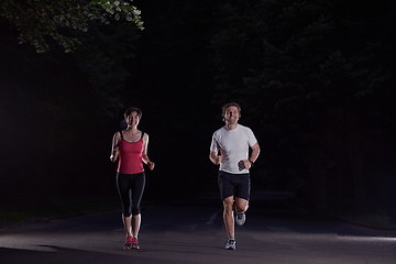 Image showing couple jogging at early morning