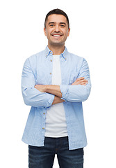 Image showing smiling man with crossed arms