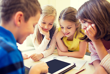 Image showing group of school kids with tablet pc in classroom