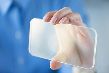 Image showing close up of woman with transparent smartphone