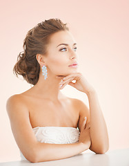 Image showing woman wearing shiny diamond earrings