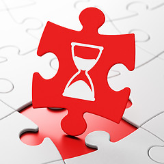 Image showing Time concept: Hourglass on puzzle background