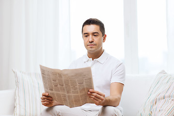 Image showing man reading newspaper at home