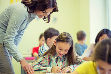 Image showing group of school kids writing test in classroom