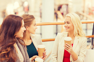 Image showing young women with shopping bags and coffee in mall