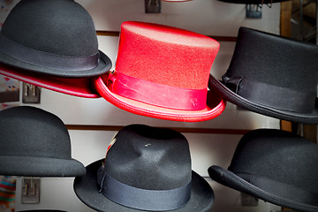 Image showing in london old red hat and black  the  fashion shop