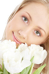 Image showing happy girl with white tulips
