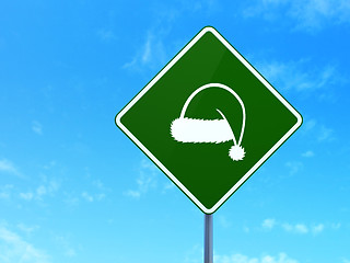 Image showing Entertainment, concept: Christmas Hat on road sign background