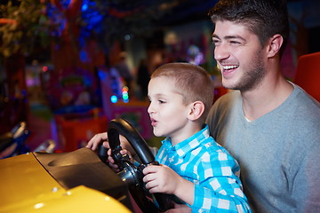 Image showing father and son playing game in playground