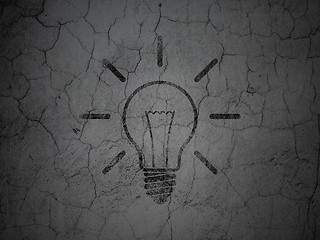 Image showing Finance concept: Light Bulb on grunge wall background