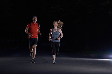 Image showing couple jogging at early morning