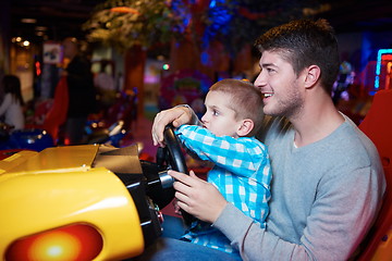 Image showing father and son playing game in playground