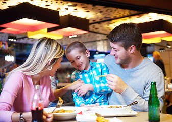 Image showing family having lunch in shopping mall