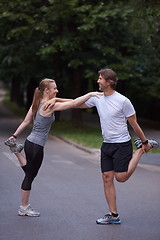 Image showing jogging couple stretching