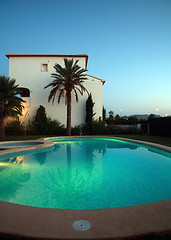 Image showing Villas with swimming pool by night