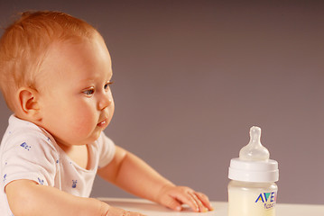 Image showing Child with a feeding bottle
