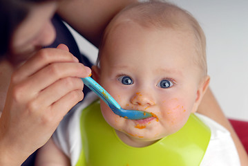 Image showing Feeding of a small child