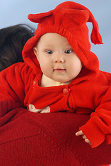 Image showing A child dressed in red