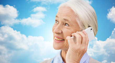 Image showing senior woman with smartphone calling