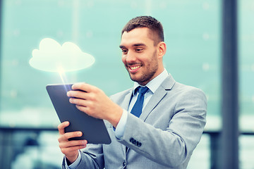 Image showing smiling businessman with tablet pc outdoors