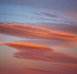 Image showing sunrise in the colored sky white soft clouds and abstract backgr