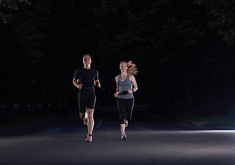 Image showing couple jogging at early morning