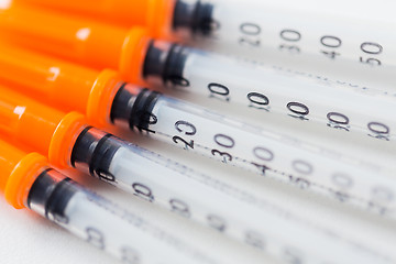 Image showing close up of insulin syringes on table