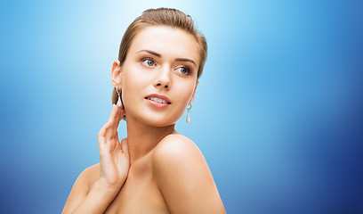 Image showing beautiful woman with diamond earrings and bracelet