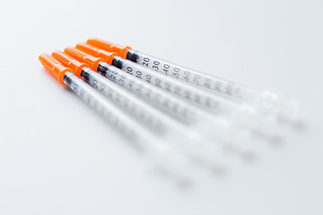 Image showing close up of insulin syringes on table