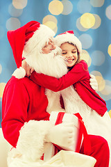 Image showing smiling little girl with santa claus