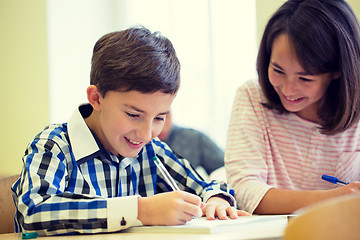 Image showing group of school kids writing test in classroom