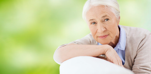 Image showing happy senior woman resting on sofa